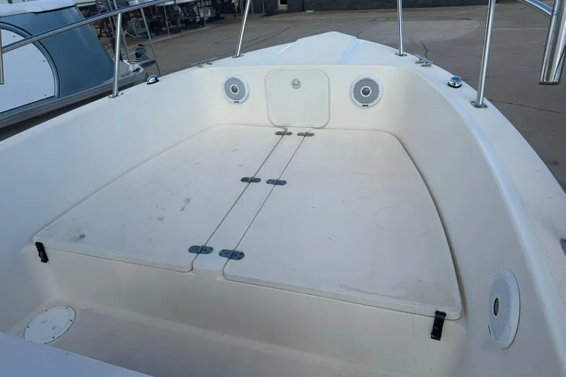 Slide: The Image of 1994 Pursuit 2150 Dual Console boat interior with storage compartments and speakers. - 6