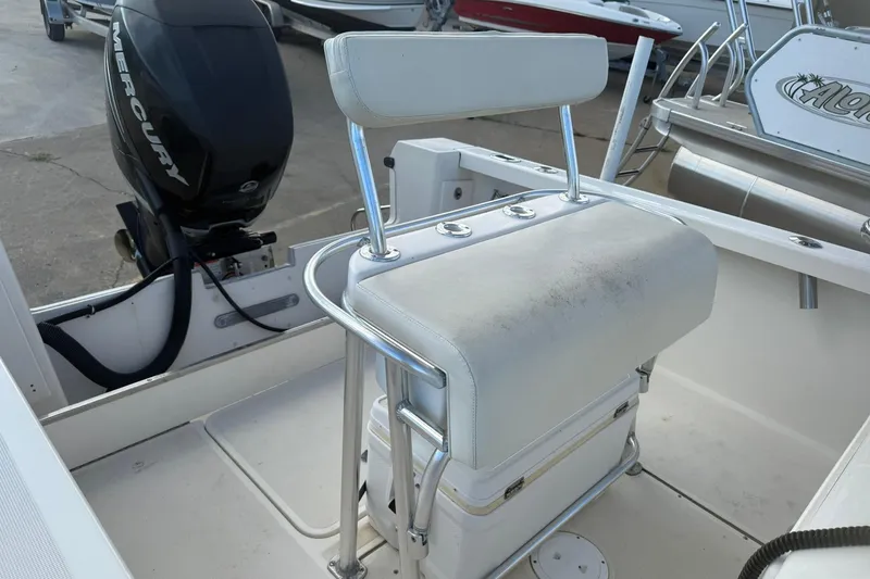 Slide: The Image of 1994 Pursuit 2150 Dual Console boat interior with Mercury outboard motor. - 7