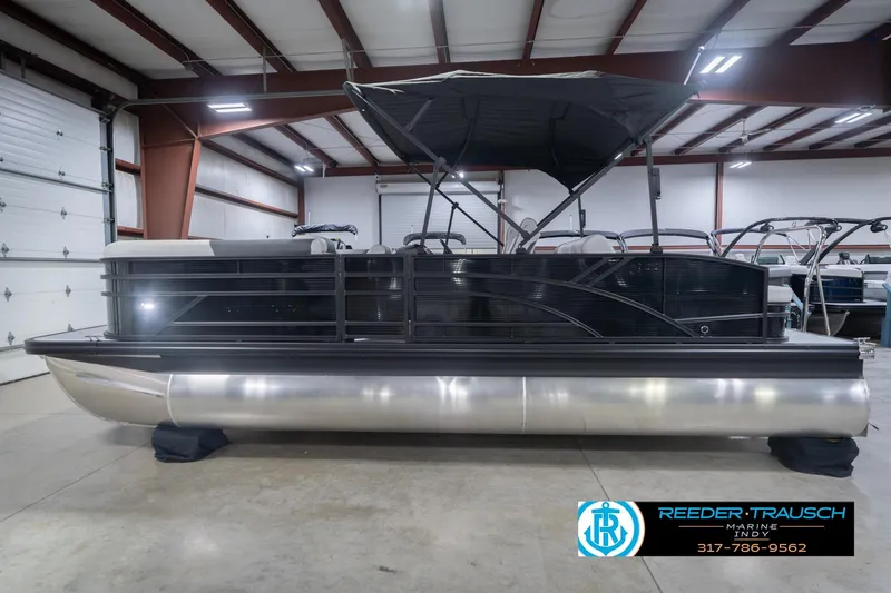 Slide: The Image of 2026 Bennington 22 SSB pontoon boat in indoor showroom, side view. - 11