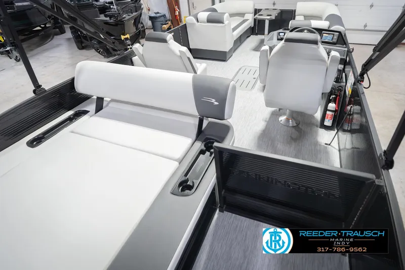Slide: The Image of 2026 Bennington 22 SSB pontoon boat interior with modern seating and control console. - 14