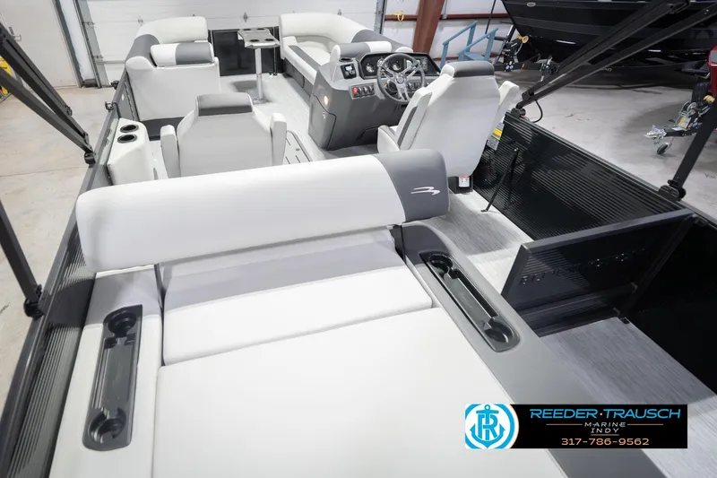 Slide: The Image of 2026 Bennington 22 SSB pontoon boat interior with modern seating and steering console. - 15
