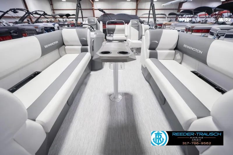 Slide: The Image of Interior of 2026 Bennington 22 SSB pontoon boat with spacious seating and table. - 16