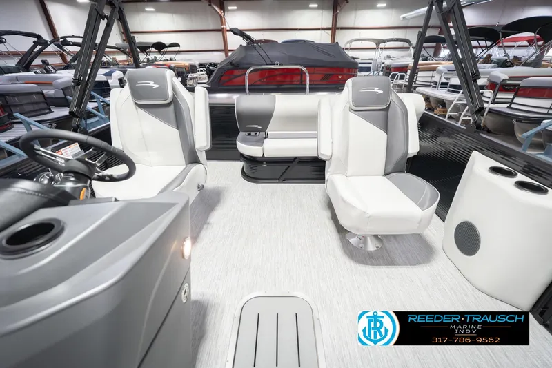 Slide: The Image of 2026 Bennington 22 SSB pontoon boat interior with modern seating and steering console. - 17