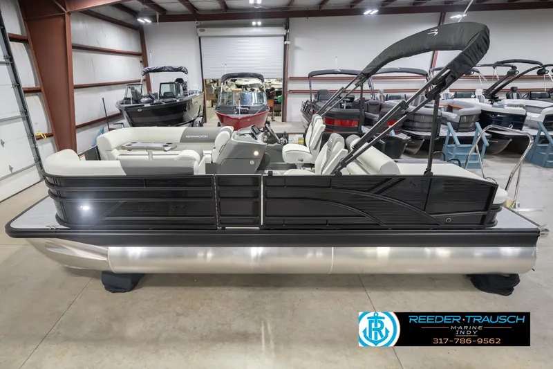The Image of 2026 Bennington 22 SSB pontoon boat in showroom, featuring sleek design and modern amenities. - 2