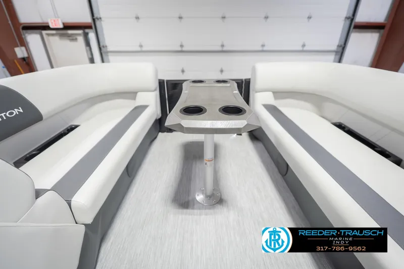 Slide: The Image of 2026 Bennington 22 SSB boat interior with sleek seating and modern table design. - 21