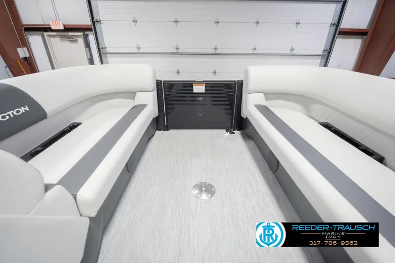 Slide: The Image of 2026 Bennington 22 SSB boat interior with white seating, showcased by Reeder-Trausch Marine. - 22