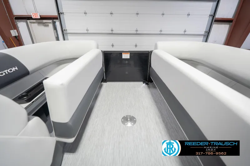Slide: The Image of Interior view of 2026 Bennington 22 SSB pontoon boat with sleek seating and flooring. - 23