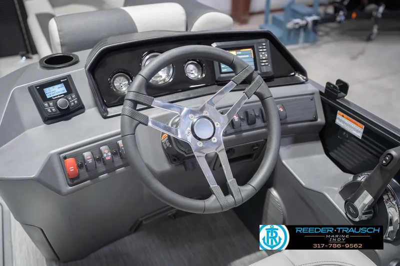 Slide: The Image of 2026 Bennington 22 SSB boat dashboard with steering wheel and control panel. - 31