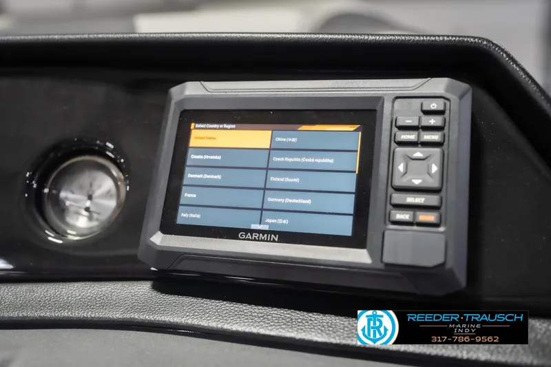 Slide: The Image of Garmin navigation system on 2026 Bennington 22 SSB boat dashboard, featuring country selection menu. - 36