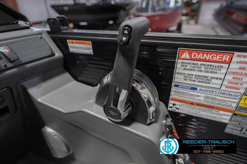 Slide: The Image of Throttle control and safety warnings on 2026 Bennington 22 SSB boat dashboard. - 38