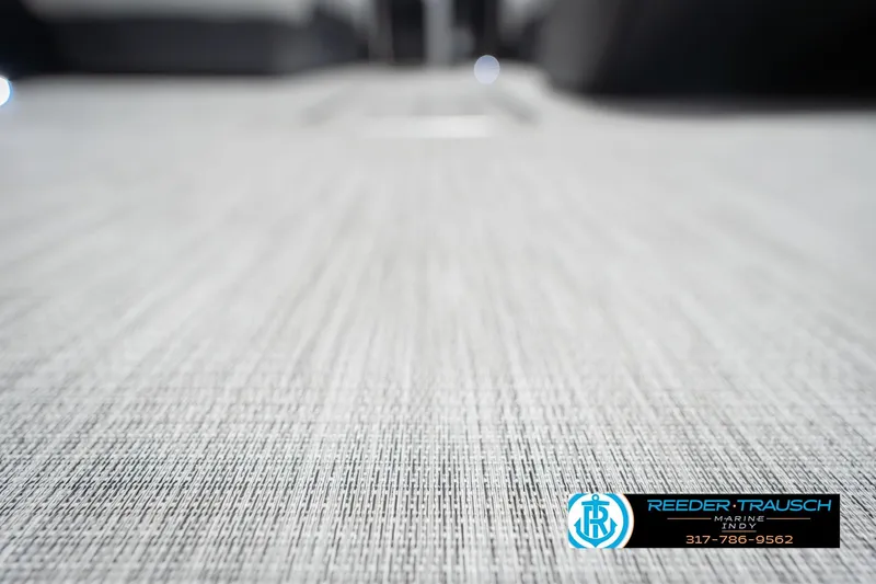 Slide: The Image of 2026 Bennington 22 SSB boat flooring with textured design, Reeder-Trausch Marine logo visible. - 47