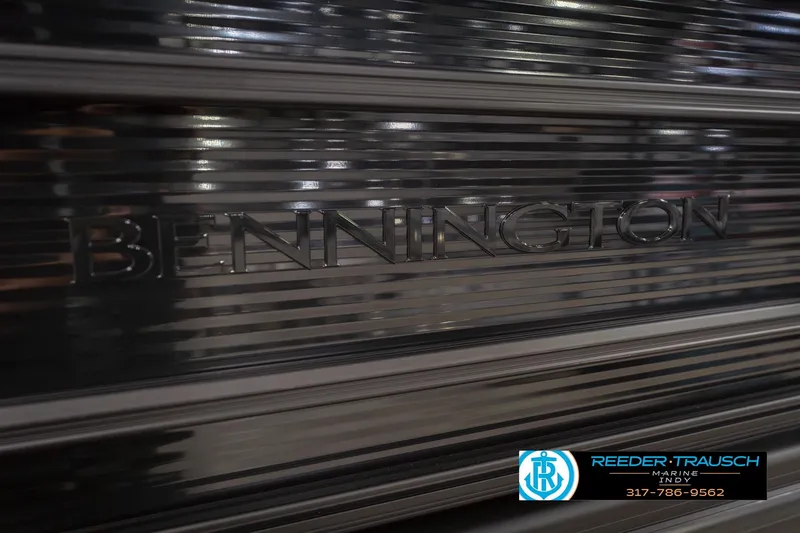 Slide: The Image of 2026 Bennington 22 SSB boat with sleek metallic finish, Reeder Trausch Marine logo. - 49