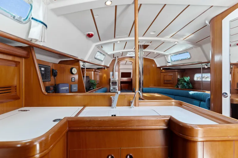 Slide: The Image of Interior of 2001 Beneteau Oceanis 361 sailboat with wood finish and modern amenities. - 13