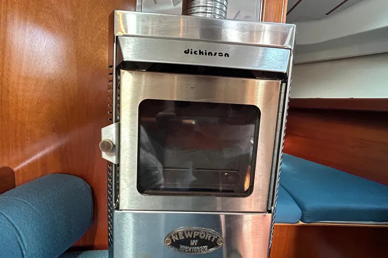 Slide: The Image of Stainless steel Dickinson Newport heater inside a 2001 Beneteau 361 sailboat cabin. - 18