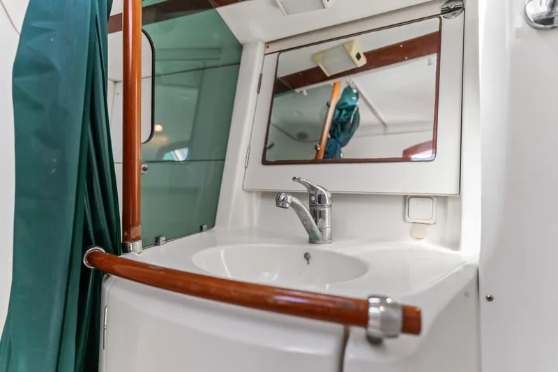 Slide: The Image of Bathroom sink and mirror on a 2001 Beneteau Oceanis 361 yacht. - 21