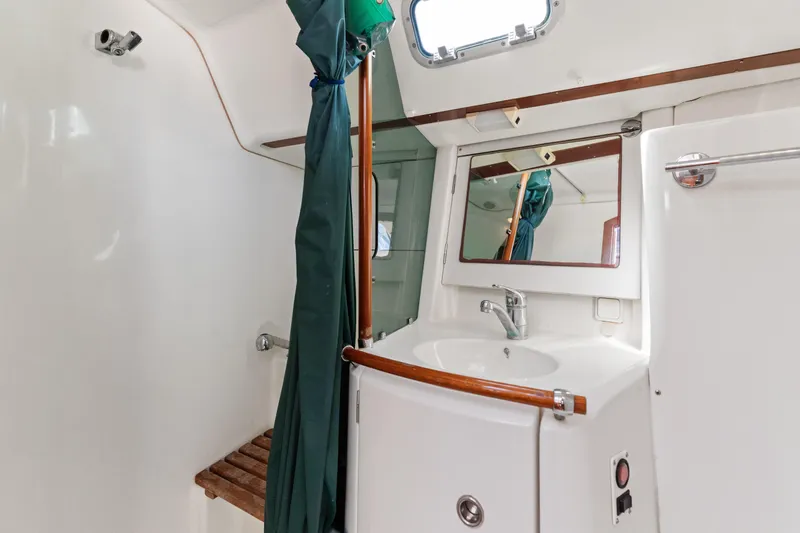 Slide: The Image of Bathroom interior of 2001 Beneteau Oceanis 361 yacht with sink and shower. - 22