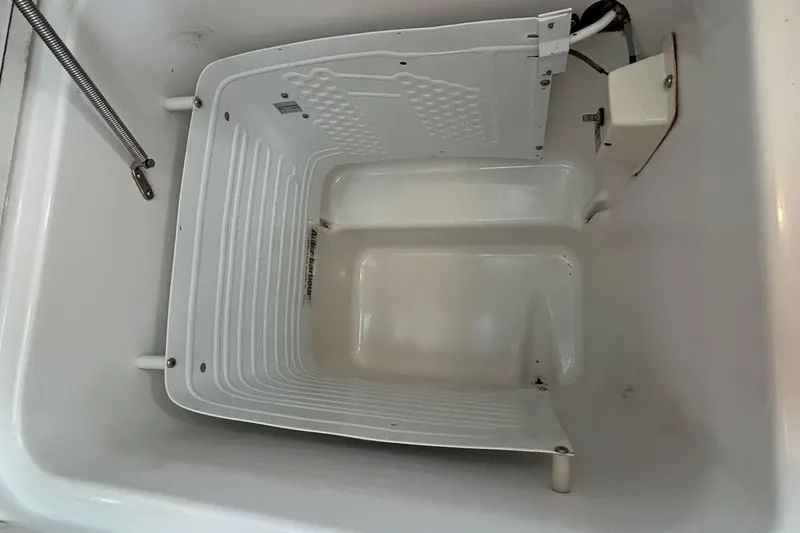 Slide: The Image of Interior view of a 2001 Beneteau 361 boat compartment, showcasing storage space. - 24