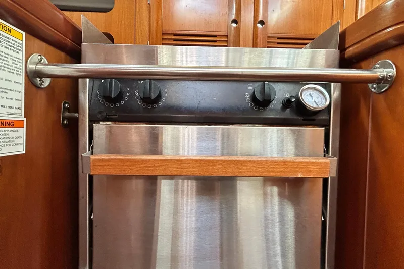 Slide: The Image of Stainless steel oven in 2001 Beneteau 361 yacht kitchen with wooden accents. - 26