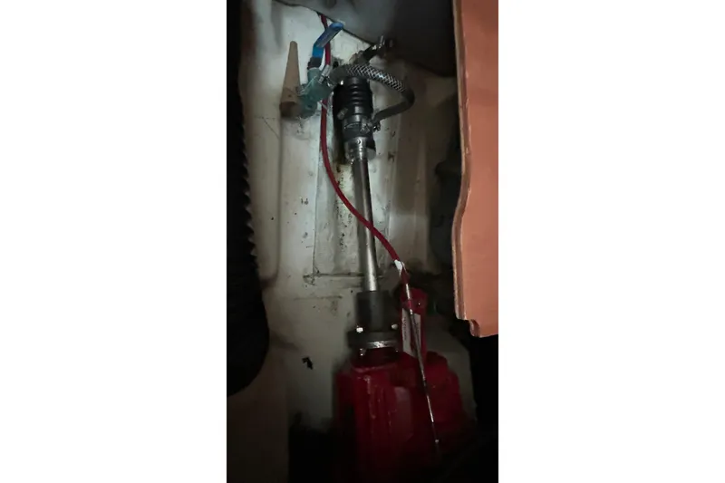 Slide: The Image of Engine compartment of a 2001 Beneteau 361 sailboat, showing mechanical components. - 32