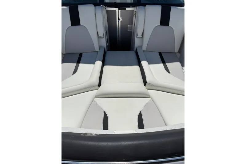 Slide: The Image of 2021 MasterCraft X24 boat interior with sleek, modern seating design. - 2