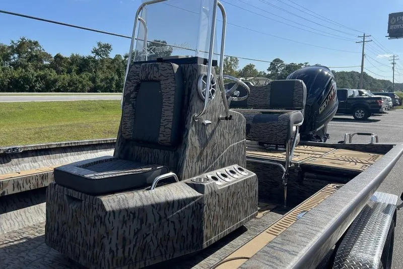 Slide: The Image of 2026 Xpress H22B Bay boat with camouflage design and modern seating. - 6