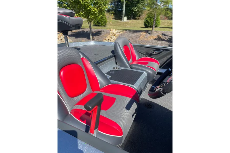 Slide: The Image of 2019 Ranger Z519 boat interior with red and gray seats, outdoor setting. - 4