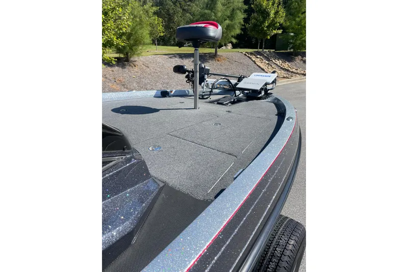 Slide: The Image of 2019 Ranger Z519 boat deck with Garmin equipment, surrounded by greenery. - 7