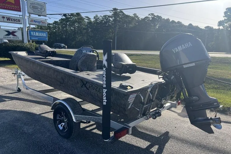 Slide: The Image of 2026 Xpress XP170 boat with Yamaha motor at Marine Service Center. - 1