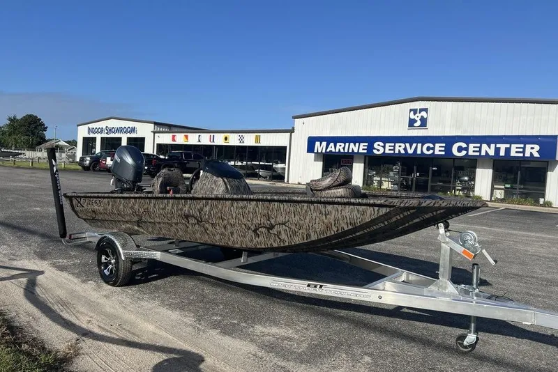 Slide: The Image of 2026 Xpress XP170 boat with Yamaha engine on trailer, parked outdoors. - 3