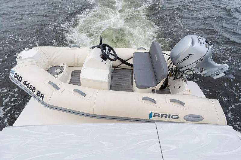 Slide: The Image of Inflatable boat with Honda motor on Tiara Yachts F44 Flybridge, 2021 model. - 10
