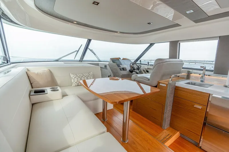 Slide: The Image of Luxurious interior of 2021 Tiara Yachts F44 Flybridge with modern seating and helm. - 26