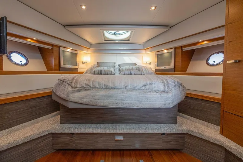 Slide: The Image of Luxurious bedroom interior of 2021 Tiara Yachts F44 Flybridge with modern design and cozy bedding. - 28