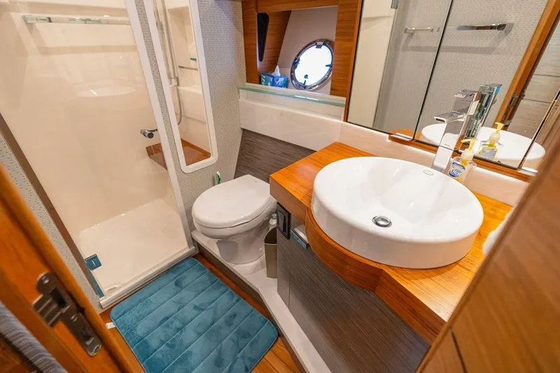 Slide: The Image of Luxurious bathroom in 2021 Tiara Yachts F44 Flybridge, featuring modern sink and shower. - 34