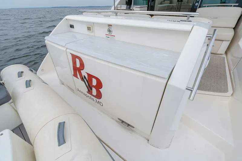 Slide: The Image of 2021 Tiara Yachts F44 Flybridge with R&B logo, Annapolis, MD, docked by the water. - 42