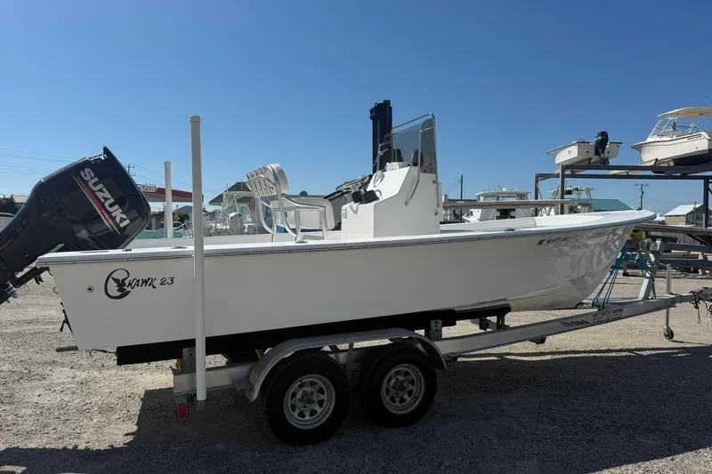 Slide: The Image of 2018 C-Hawk 23 Center Console boat on trailer with Suzuki outboard motor. - 3
