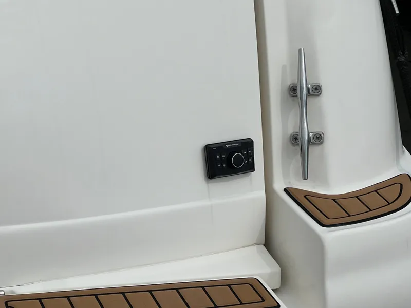 Slide: The Image of 2003 Sea Ray 320 Sundancer boat detail with control panel and teak accents. - 42