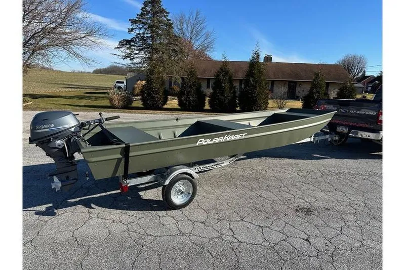 The Image of 2024 Polar Kraft 1648 Jon Boat with Yamaha 20 hp engine on trailer. - 1