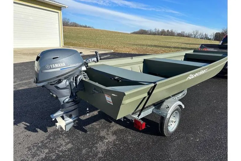 Slide: The Image of 2024 Polar Kraft 1648 Jon Boat with Yamaha 20 hp motor on trailer, parked outdoors. - 4