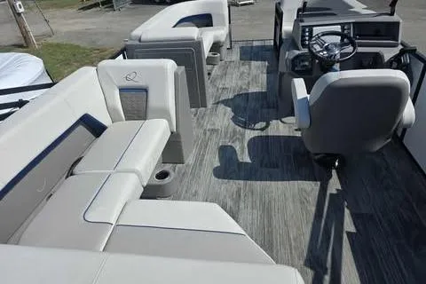 Slide: The Image of 2026 Qwest XRE E-Class boat interior with modern seating and steering console. - 4