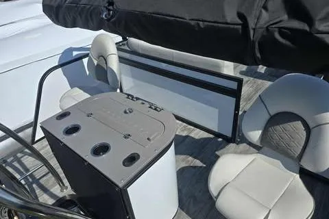 Slide: The Image of 2026 Qwest XRE E-Class boat interior with seating and table setup. - 7