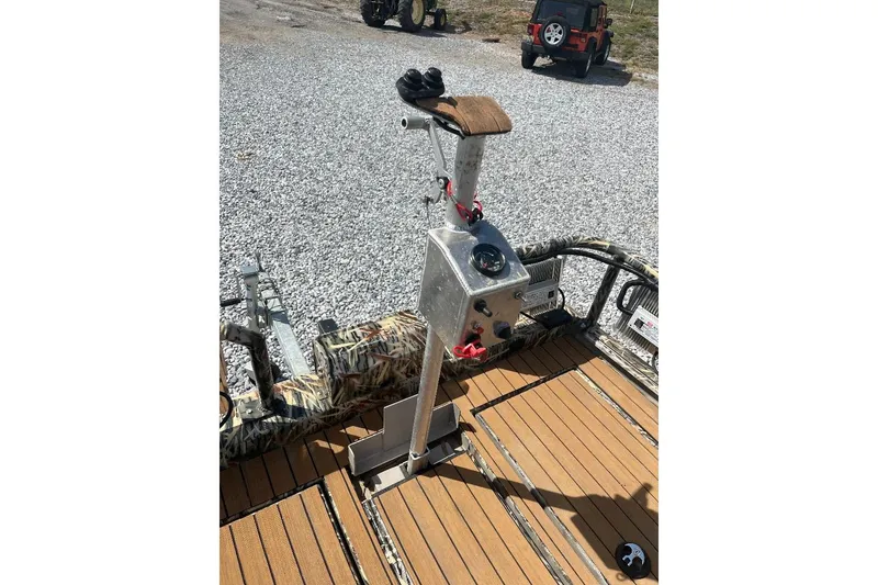 Slide: The Image of Battery compartment of 2024 Cobb's Custom Boats 1854 with wiring and connections. - 9