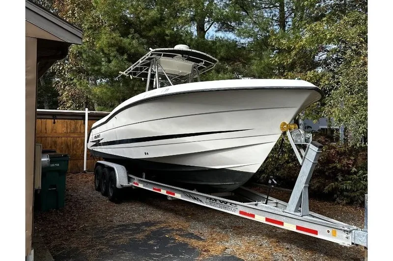 The Image of 2000 Hydra-Sports 2796 CC Vector boat on trailer, parked outdoors. - 0
