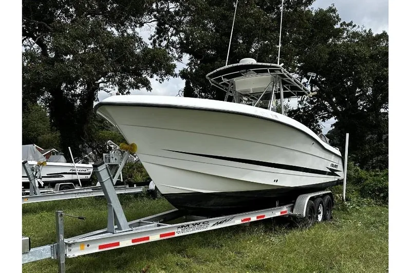 Slide: The Image of 2000 Hydra-Sports 2796 CC Vector boat on trailer, parked outdoors. - 2