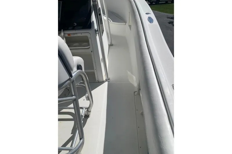 Slide: The Image of 2000 Hydra-Sports 2796 CC Vector boat interior, featuring sleek white deck and seating. - 7