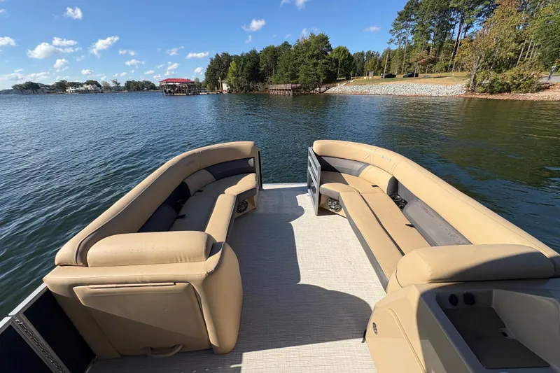 Slide: The Image of 2023 Harris HCX 230 Stern Radius pontoon boat on a scenic lake. - 17
