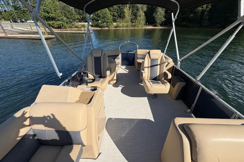 Slide: The Image of FBC Service Promise: Engine warranty, financing, certified maintenance, free training. Harris HCX 230 Stern Radius 2023. - 3