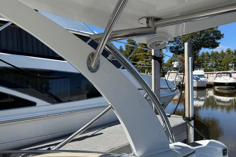 Slide: The Image of 2021 Cobalt 30SC boat detail at marina, showcasing sleek design and stainless steel features. - 14