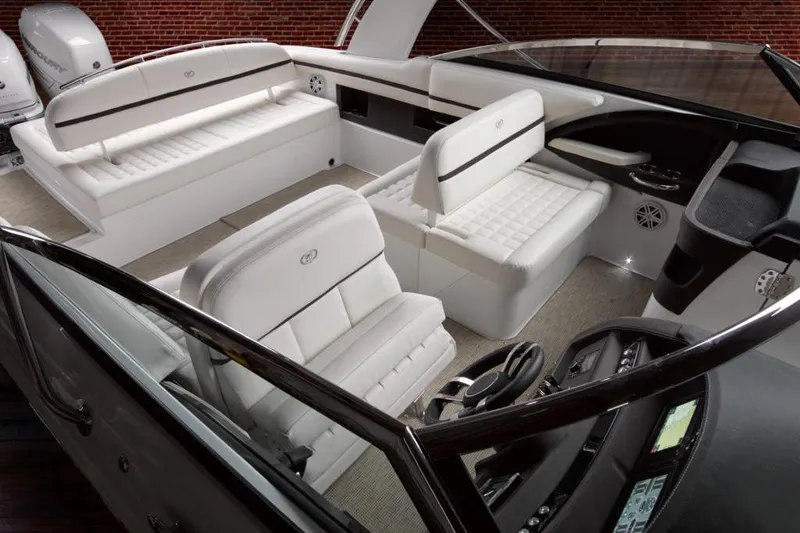 Slide: The Image of Manufacturer Provided Image: Luxurious interior of a 2021 Cobalt 30SC boat with white leather seating. - 16
