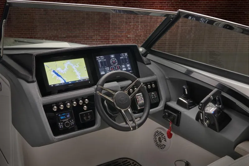 Slide: The Image of Manufacturer Provided Image: 2021 Cobalt 30SC boat dashboard with navigation and control systems. - 17