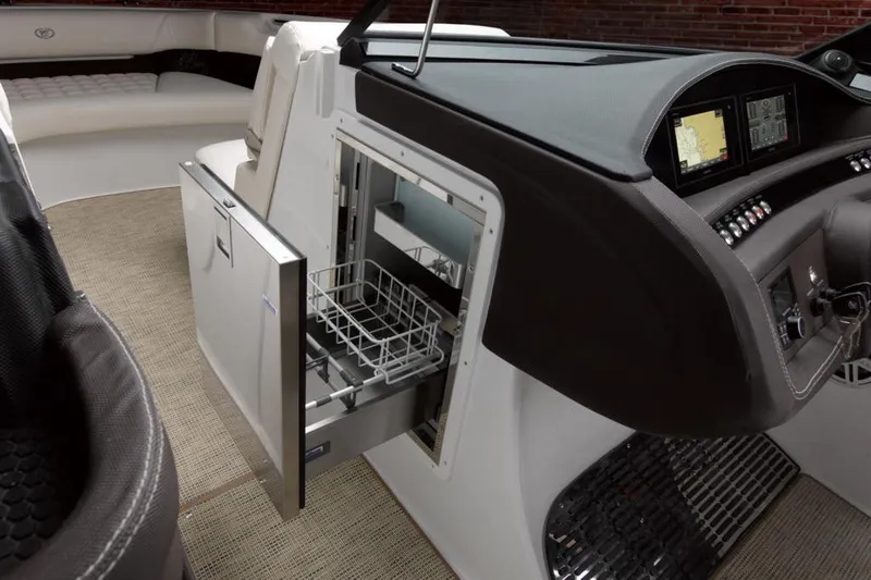 Slide: The Image of Manufacturer Provided Image: 2021 Cobalt 30SC boat interior with open drawer and control panel. - 20